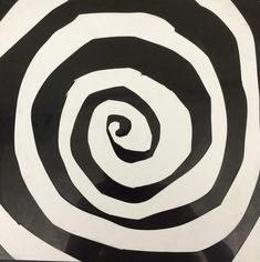 a black and white spiral design is shown in the center of this image, it appears to be painted with acrylic paint