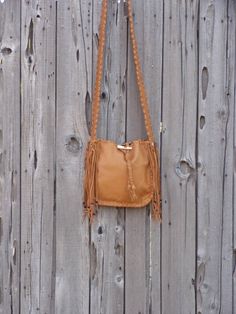 This leather tote is a great size for your every day needs. This bag is made of saddle tan leather and is 10 inches tall, 10 inches wide and 2.75 inches deep. We can make this bag in any of the colors of leather you see in our shop. It has an extra pocket inside and a comfortable 48 inch flat strap. Let us know how long you like your strap. We can make this bag in a variety of colors of soft tanned cowhide ( see the last photo ). Just leave a note at check out or contact us... This item is MADE Camel Leather Hobo Bag With Adjustable Strap, Rectangular Bags With Tassels For Fall, Fall Rectangular Bag With Tassels, Rectangular Fall Bag With Tassels, Leather Hobo Bag With Tassels In Crossbody Style, Leather Hobo Bag With Fringe, Leather Hobo Shoulder Bag With Fringe, Leather Fringe Hobo Shoulder Bag, Leather Crossbody Bag With Tassels