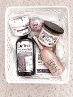 a white basket filled with different types of beauty products