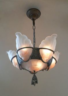 a chandelier hanging from the ceiling in a room