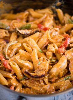 pasta with chicken and peppers in a pan