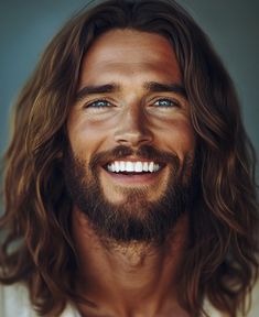 a man with long hair and blue eyes smiling