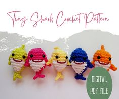 four small crocheted toy figures are lined up in a row, with the text tiny shark crochet pattern above them