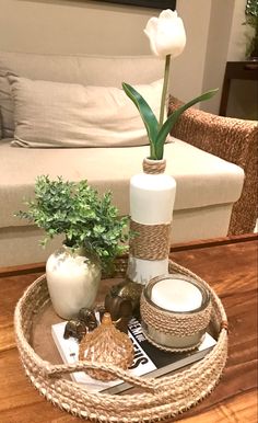 a living room with a couch, table and coffee table in the centerpieces