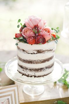 a white cake with flowers on top