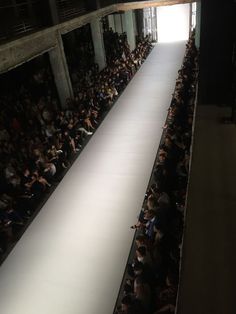 a catwalk is shown as people watch