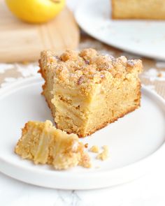 a piece of cake on a white plate next to a slice of lemonade pie