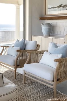 two wicker chairs sitting next to each other on top of a carpeted floor