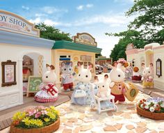 the toy shop has many stuffed animals in it's display area and is decorated with flowers