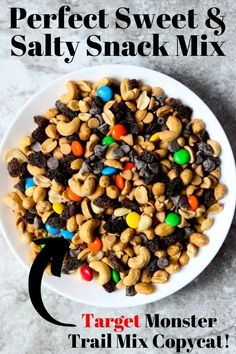 a white plate filled with cereal and m & m's on top of a table