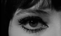 a woman's eye with long eyelashes