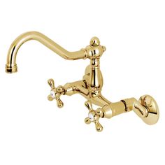 a gold faucet with two handles and nozzles on the side,