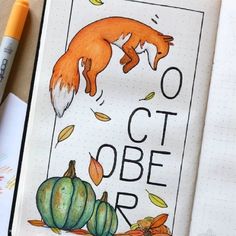 an open notebook with the words october written on it and a drawing of a fox jumping over pumpkins