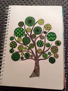 a drawing of a tree with green and yellow leaves on it's branches, surrounded by circles