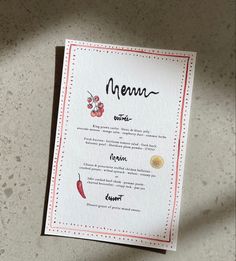 a menu card sitting on top of a table