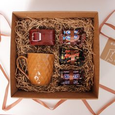 an open box containing coffee, chocolates and candy