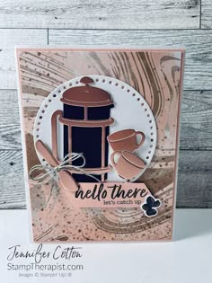 a close up of a card with a coffee pot