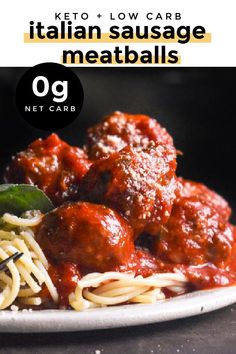 a white plate topped with spaghetti and meatballs