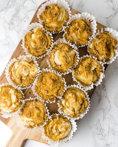 several muffins are sitting on a cutting board