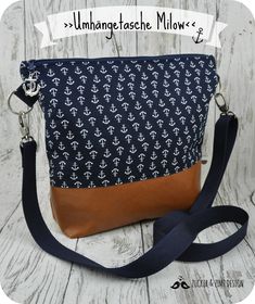 a purse with an anchor pattern on it