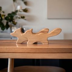 a wooden toy sitting on top of a table