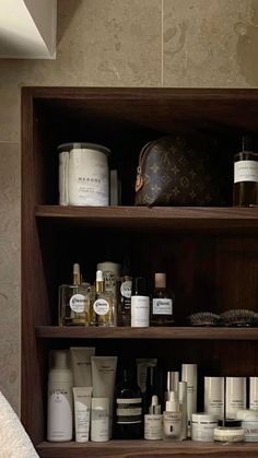 a wooden shelf filled with lots of personal care items