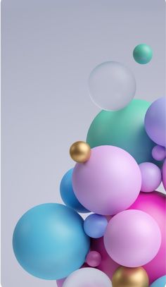 colorful balloons floating in the air on a gray background