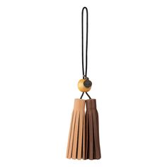 two leather tassels hanging from a cord on a white background, one with a wooden bead