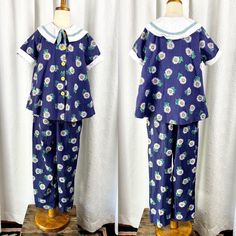 "Blue sunflower cotton set with sweet collars. Made in the USA. Elastic waist on pants. The sizing on this piece would be great as it is super flexible. Size: 8 Brand: Cottontail Originals Fabric: 100% cotton Measurements laid flat (top): Shoulders: 14\" Pit to pit: 17.5\" Length: 20\" Measurements laid flat (bottoms): Waist: 10\" unstretched Length: 31\" Inseam: 20\" Please note that all listings are vintage and therefore are preowned. General wear is not noted in listings. I do try hard to tho Blue Collared Fitted Sets, Blue Fitted Collared Set, Retro Fitted Cotton Sets, Fitted Cotton Sets For Daywear, Vintage Cotton Sets For Daywear, Cute Cotton Daywear Sets, Cute Cotton Sets For Daywear, Retro Cotton Short Sleeve Sets, Retro Cotton Sets With Short Sleeves