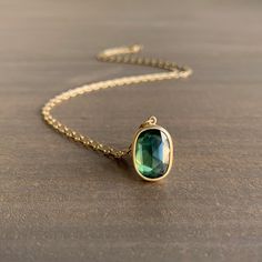 Verdant with a hint of citrus, this sapphire is the perfect combination of glowing green and scintillating sparkle. 18ky Sapphire, 3.59 carats, 9mm x 12mm (3/8" x 1/2") Chain is 18" long Oval Green Sapphire Jewelry, Gold Sapphire Necklace With Faceted Detail, Green Oval High Luster Jewelry, Green Sapphire Necklace, Colored Wedding Bands, Newport Rhode Island, Pink Sapphire Ring, Newport Ri, Crescent Moon Necklace