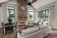 a living room with couches, tables and a clock on the wall in it