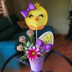 a vase filled with flowers sitting on top of a table