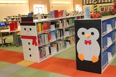 an empty library filled with lots of books and stuffed animals on the shelves in front of them