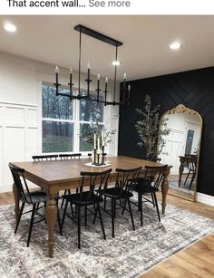 a dining room table with chairs and a rug on the floor in front of it