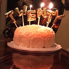 a birthday cake with candles that say twenty