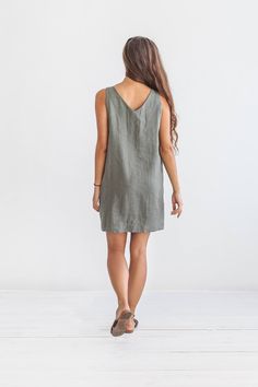 "DESCRIPTION: ♥ 100% natural European linen; ♥ safe Oeko-TEX® Standard 100 certified linen fabric ♥ softened midweight linen (185 g/m2) ♥ sleeveless dress ♥ v neckline FIT ♥ length from the lower to the upper seam is about 33.5 inches / 85 cm ♥ measurements taken from a size S ♥ model is 170 cm and wearing a size S SIZE CHART: XS: Bust 30.7\"- 32.7\" (78-83 cm) , Waist 23.6\"- 25.6\" (60-65 cm), Hips 33.5\"- 35\" (85-89 cm) S: Bust 33\"- 35\" (84-89 cm) , Waist 26\"- 28\" (66-71 cm), Hips 35.5\" Linen V-neck Mini Dress For Vacation, Summer Linen V-neck Sundress, Casual Linen V-neck Mini Dress, Summer Linen V-neck Mini Dress, Summer Linen Mini Dress With V-neck, Vacation Linen Mini Dress, Linen V-neck Sleeveless Sundress, Casual Linen Mini Dress, Casual Mini Linen Dress