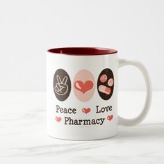 two coffee mugs with peace love pharmacy on them