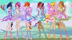 four girls dressed in fairy costumes standing next to each other with their hands on their hipss