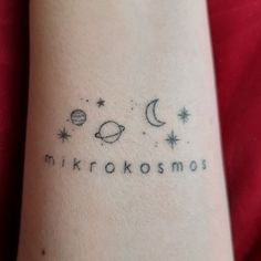 a tattoo with the word mikrakosmos written on it's arm