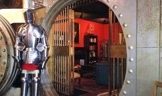 a large metal clock sitting inside of a room