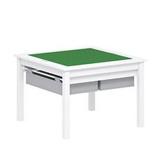 a small white table with green top and drawers on the bottom shelf, in front of a white background