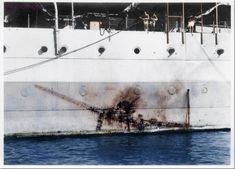 a large white ship with rust on it's side