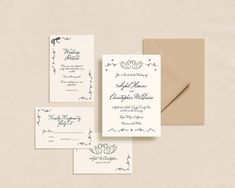 the wedding stationery is laid out on top of each other