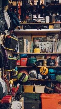 a room filled with lots of clutter and bags on shelves next to each other