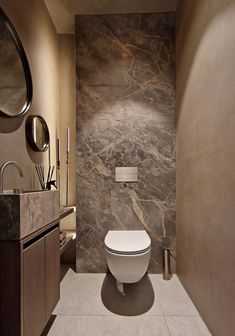 a modern bathroom with marble walls and flooring