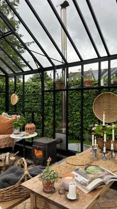 an outdoor living area with wooden tables and wicker chairs, potted plants on the table