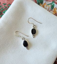 These elegant black dangle earrings are crafted of sterling silver and are lightweight for all day wear. - Simulated Black Onyx Inlay - Crafted of genuine sterling silver - 1/2" High (without hooks) and 1/4" Wide - Weight is about 2.1 grams Orders will ship out in 1-3 business days from my Arkansas studio. In addition to your jewelry, you'll receive a silver polishing cloth and art extra such as bookmark or mini print. Jewelry will be wrapped in anti-tarnish paper and placed inside a white box o Minimalist Black Sterling Silver Earrings, Black Hypoallergenic Sterling Silver Jewelry, Black Dangle Earrings For Everyday, Black Drop Earrings For Everyday, Everyday Black Sterling Silver Jewelry, Everyday Black Drop Earrings, Black Hypoallergenic Sterling Silver Earrings, Black Sterling Silver Teardrop Earrings, Black Teardrop Sterling Silver Earrings