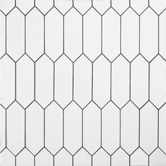 a white tiled wall with black lines on it