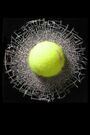 a yellow tennis ball is in the middle of a racket and some white wire