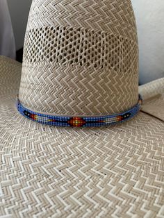 "1/4\" wide All bead work is beaded with 10lb extreme braided nylon line. All hat bands are finished at 23\" with glued than sewed down leather ends and an adjustable leather tie." Blue Arrow, Loom Designs, Beaded Hat Bands, Purple Hat, Bead Loom Designs, Hat Bands, Beaded Hat, Purple Hats, Leather Tie